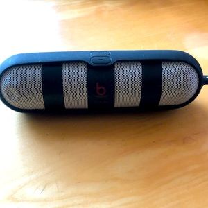 Beats Pill Speaker with a case.